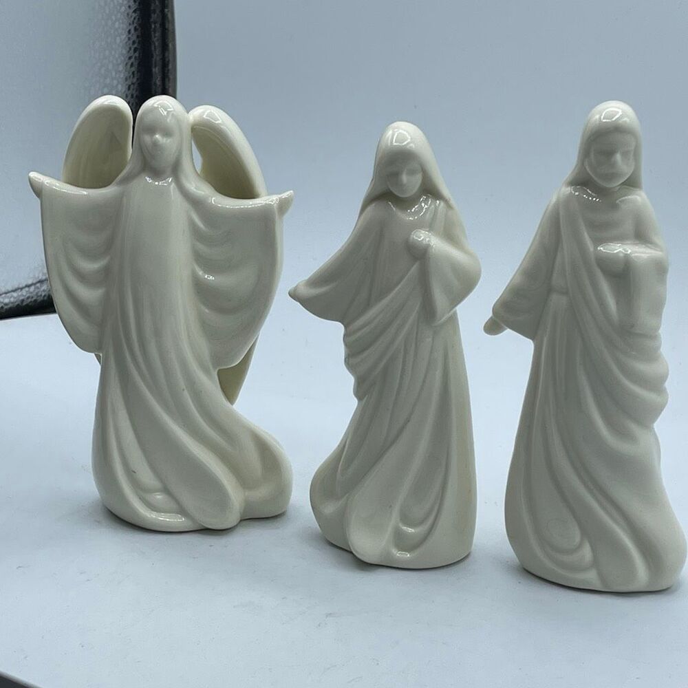 Lot of 3 vintage House of Lloyd Christmas around the World figurines.